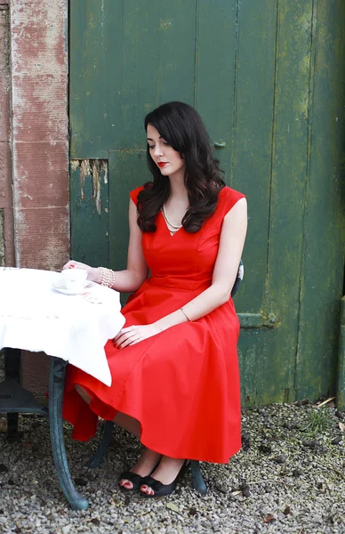 Beautiful woman wearing a red dress — Stock Photo, Image