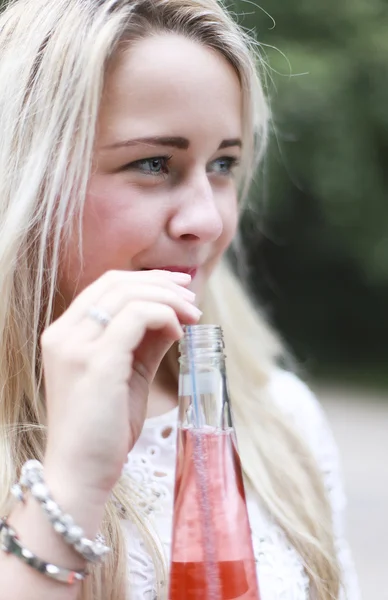 Teenage girl drinking — Stock Photo, Image