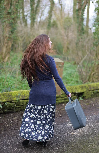 Young woman with suitcase — Stock Photo, Image