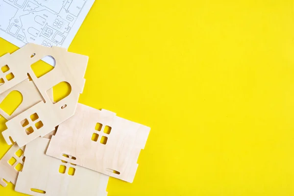 Details and instructions, constructor of prefabricated wooden orphanage on yellow background