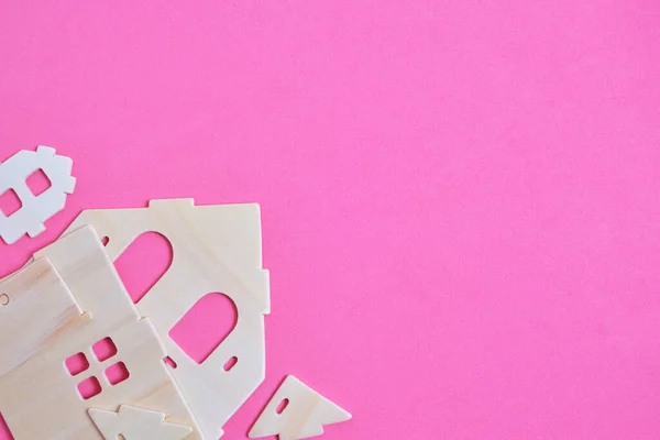 Details of constructor of prefabricated wooden orphanage on pink background