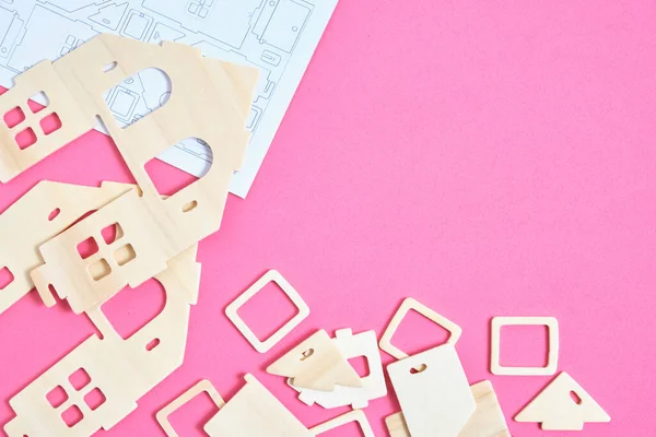 Details and instructions, constructor of prefabricated wooden orphanage on pink background
