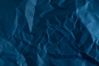 Crumpled blue paper background. Texture of crumpled paper