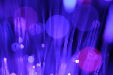 Fiber optik arka planda bir sürü ışık noktası ve bokeh