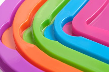 Renkli plastik yüzeyler ve geometrik çizgilerin soyut makro arkaplanı