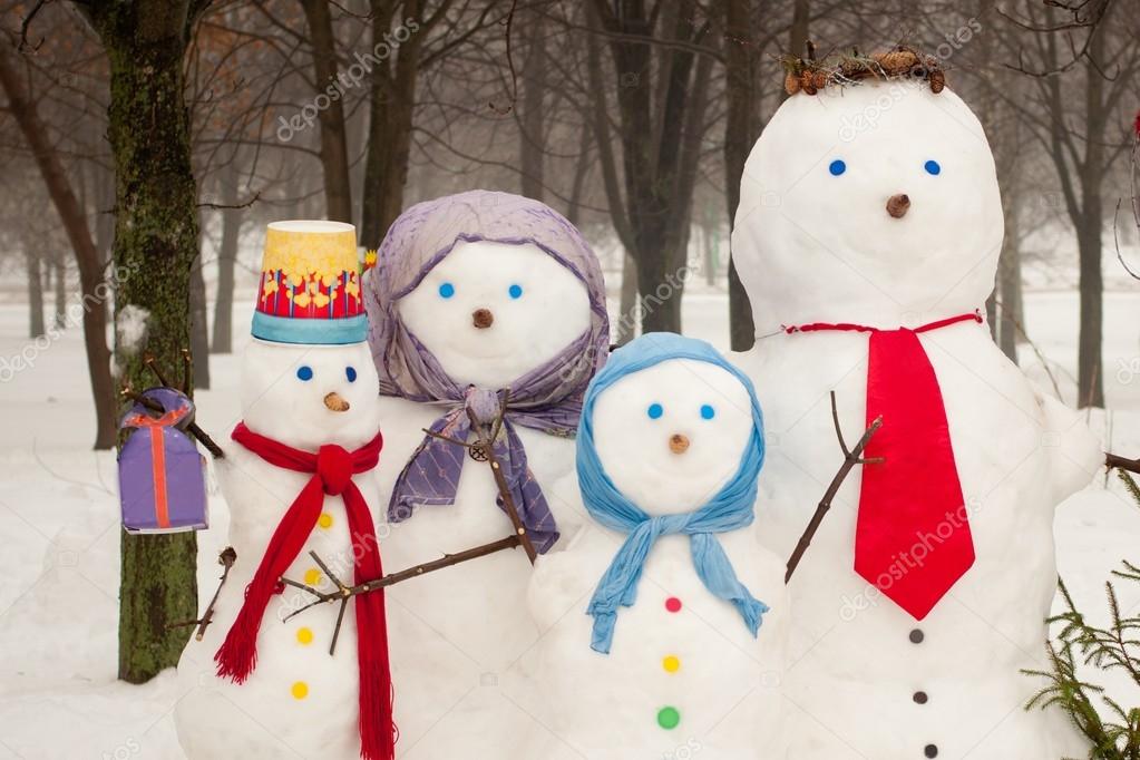 Family of snowmen outdoors