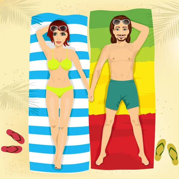 Happy couple in swimsuit lying on towels holding hands on the beach — Stock Vector