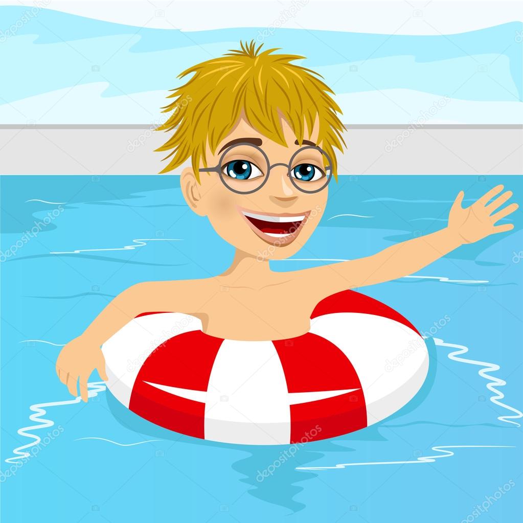 cute little boy swimming in pool with inflatable ring