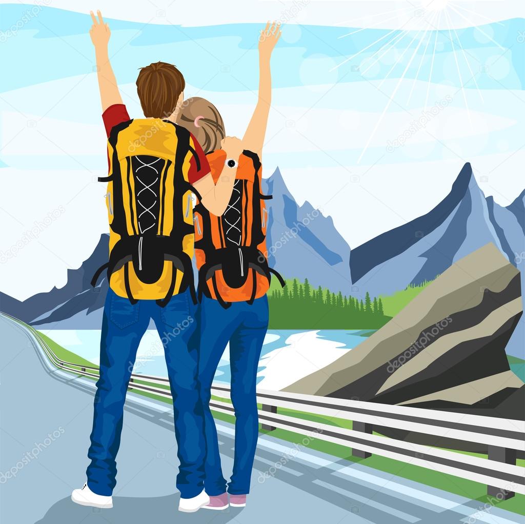 young couple of hitchhikers standing on road and enjoying mountain scenery