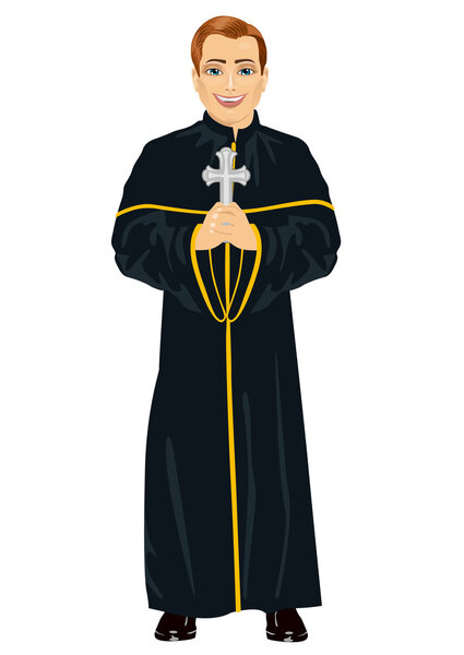 Young christian priest in cassock holding a cross