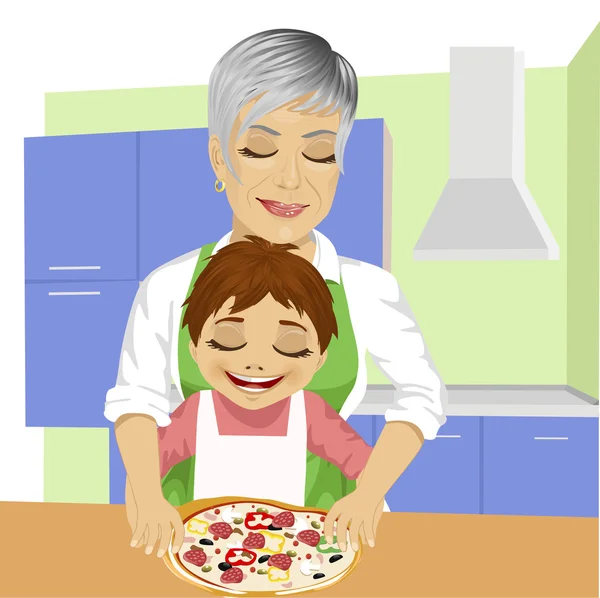 Nonna con suo nipote preparare deliziosa pizza insieme in cucina — Vettoriale Stock