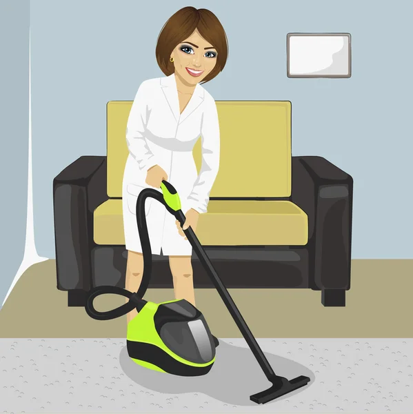 Mujer joven en una alfombra blanca de limpieza de albornoz con aspiradora en casa — Vector de stock