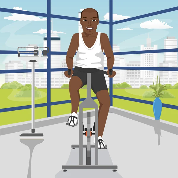 African american man doing exercise on bike at gym — Stock Vector