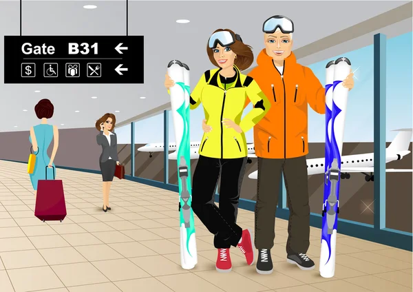 Happy couple skiers standing in the hall of the airport — Stock Vector