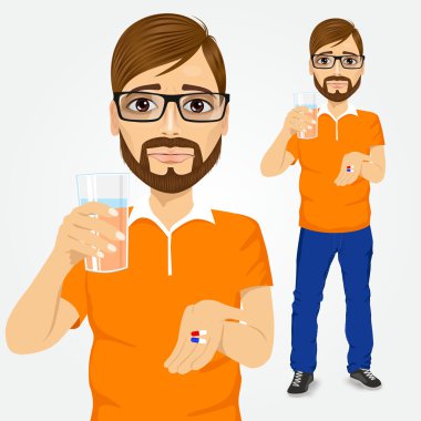 üzgün adam bardak su ile hapları