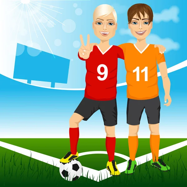 Dos jóvenes jugadores de fútbol amigos — Vector de stock