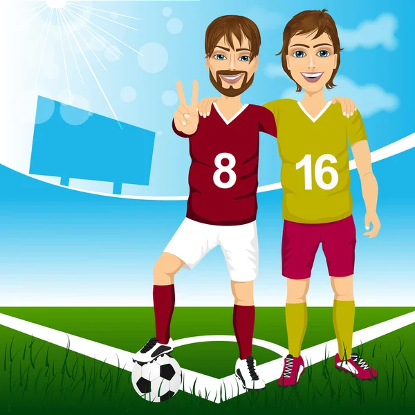 Dos jóvenes jugadores de fútbol amigos — Vector de stock