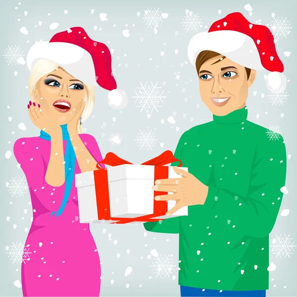 Мужчина и женщина с рождественским подарком — стоковый вектор