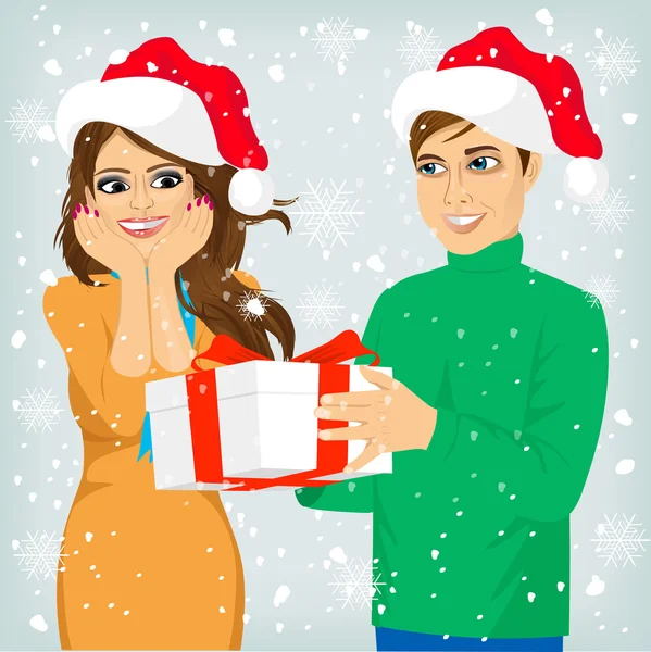 Мужчина и женщина с рождественским подарком — стоковый вектор