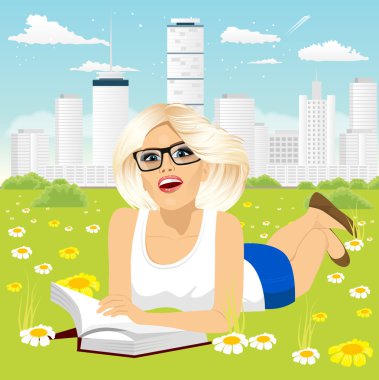 woman lying down on grass reading book clipart