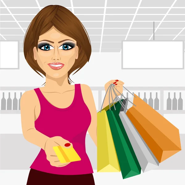 Mujer joven sosteniendo bolsas de la compra y dando una tarjeta de crédito — Vector de stock