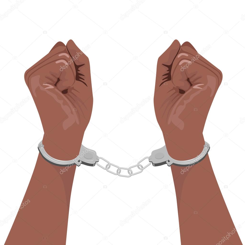 pair of african american hands in handcuffs