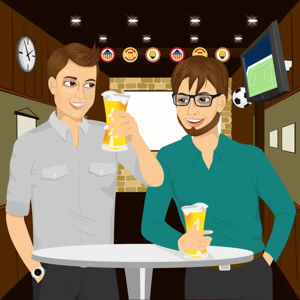 Two cheerful young men talking to each other and gesturing while drinking beer at round table — Stock Vector