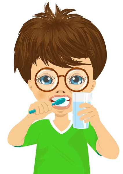 Cute little boy brushing teeth — Stock Vector