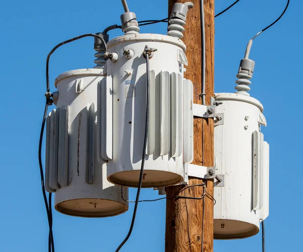 Electrical transformers transfer electricity from one circuit to another. They are used in a wide range of residential and industrial applications, primarily  in the distribution and regulation of power across long distances.