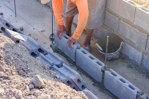 Workers are laying blocks of bricks, Construction work