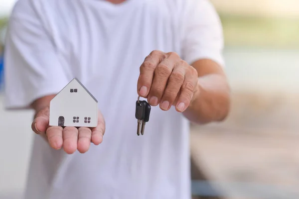 toy house in male hand, dream house