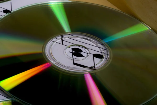 Cd and sheet music with musical notes — Stock Photo, Image