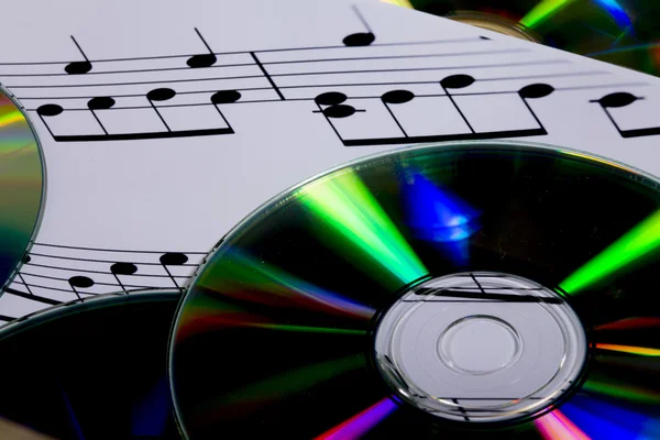 CD et partitions avec notes de musique — Photo