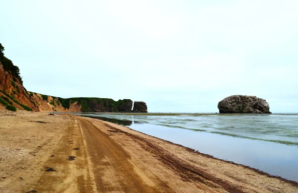 Rocky beach on the coast of the Sea of Okhotsk, Tikhaya Bay, Sakhalin Island
