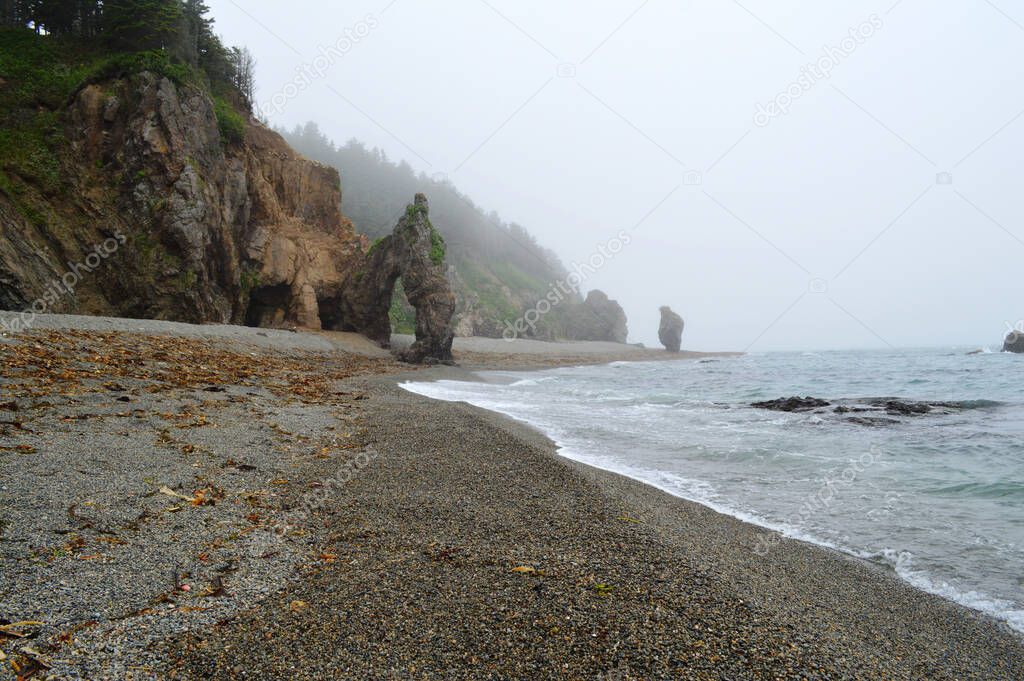 Rocky shores and a wild beach in the bay of the Sea of Okhotsk, Sakhalin Island