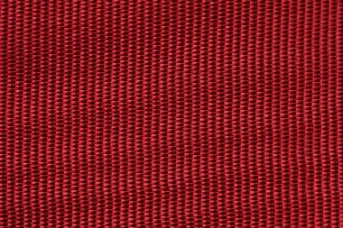 İpek kumaş arka planının kırmızı rengi. Resim fotoğrafı.