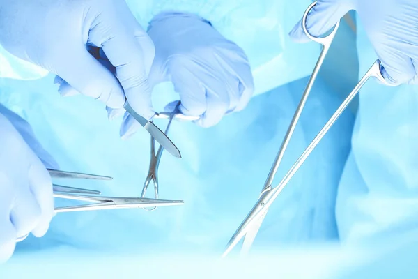 A group of surgeons is operating at the hospital, close-up of hands. Health care concept — Stock Photo, Image