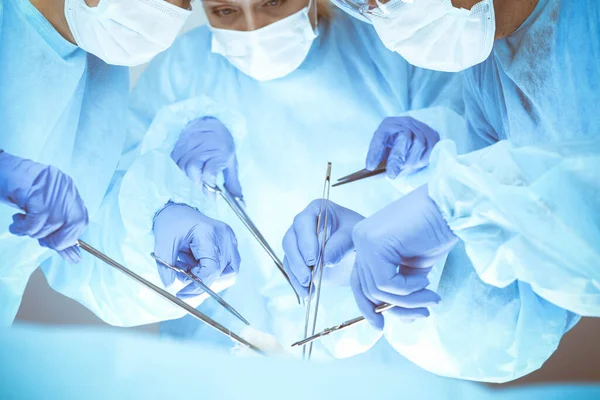 A group of surgeons is operating at the hospital, close-up of hands. Health care concept — Stock Photo, Image