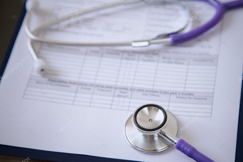 Purple Stethoscope On The Glass Desk Stock Photo C Rogerphoto