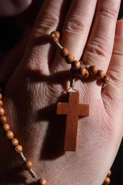 Prayer hands with crucifix