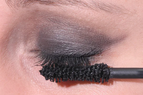 Eye with makeup and brush of mascara — Stock Photo, Image