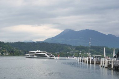 Lucerne, Switzerland- May 20, 2019- Scenic view of Alps from Lake lucerne and a view of old town of Lucerne in in Switzerland