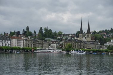 Lucerne, Switzerland- May 20, 2019- Scenic view of Alps from Lake lucerne and a view of old town of Lucerne, Switzerland