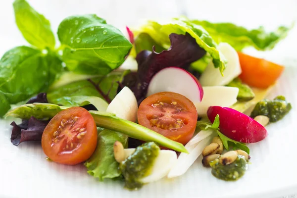 Summer leaf salad on a wooden background — Stock Photo, Image