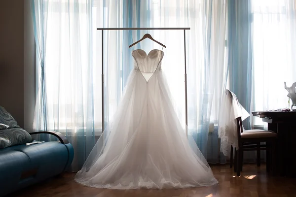 The perfect wedding dress with a full skirt on a hanger