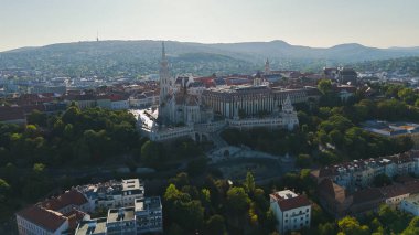 Stunning aerial view of Budapests iconic Fishermans Bastion, showcasing its historic towers and panoramic cityscape