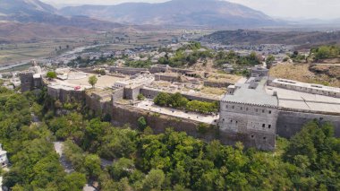 Drone view highlighting the stone walls and towers of Gjirokaster Fortress in Albania