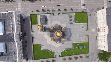 Drone top-down aerial view of Christ the Savior Orthodox Cathedral in Banja Luka showing the golden domes, roof details, and surrounding square