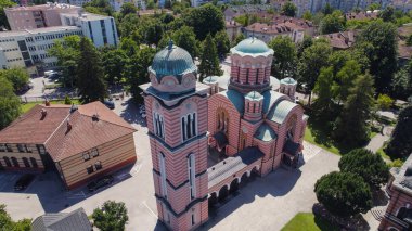 Aerial drone view of the Orthodox Christian Church of Holy Trinity in Banja Luka showing the church, domes, and nearby streets