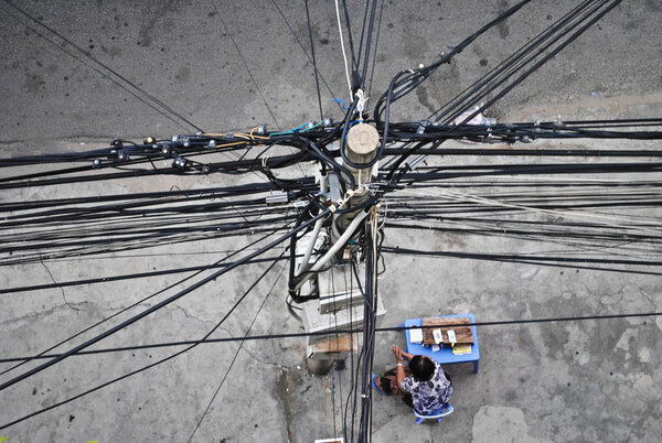 Lamppost and crisscrossing wires